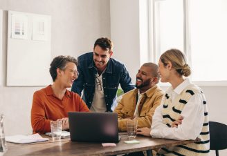 Cheerful designers having a meeting in an office